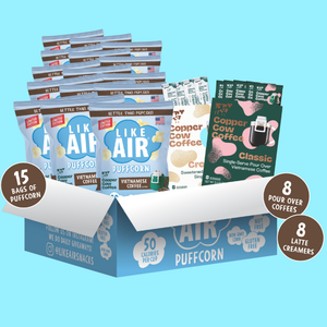 Box of Like Air puffcorn and Copper Cow coffee packages on a light blue background