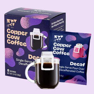 Copper Cow Coffee Decaf packaging with a mug filled with coffee on a light purple background